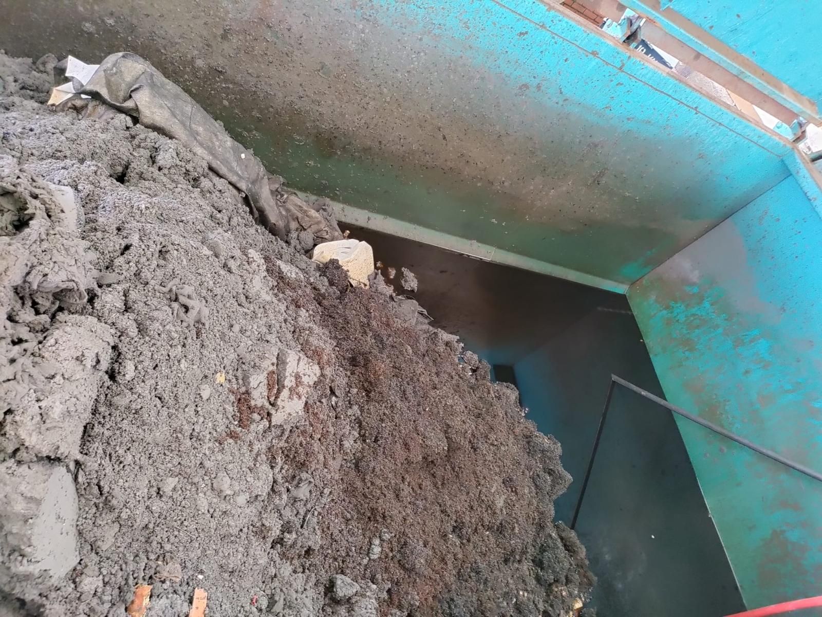 Silt and hydrocarbon sludge lifted out of an interceptor chamber during a scheduled clean.